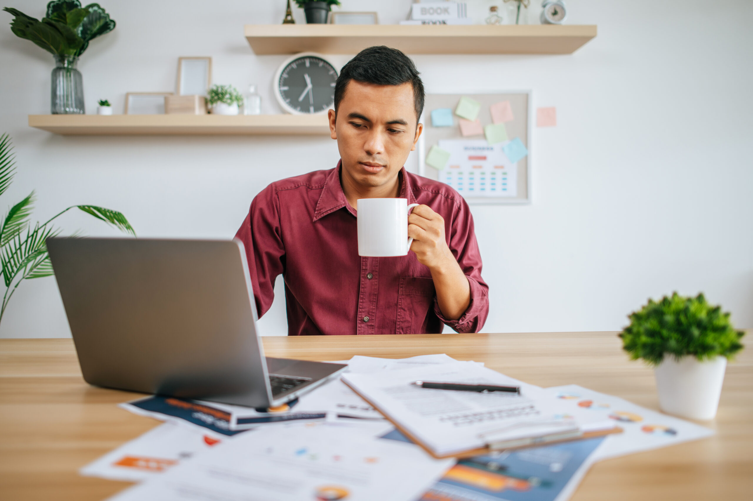 A man working with laptop Confident entrepreneur setting up a Singapore company with proper compliance foundations in place